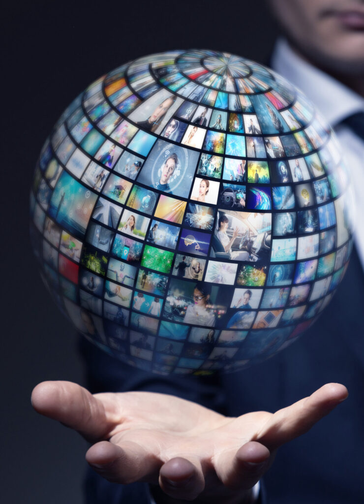 man with a floating globe made of screen images
