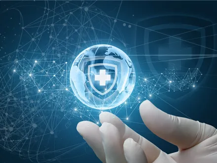 Graphic of gloved hands holding a crystal globe with a healthcare cross embossed on it