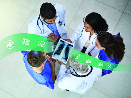 4 doctors looking at exa workflow on tablet screen