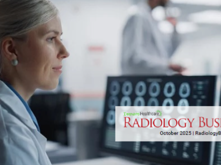 An image of a female radiologist reviewing images on a computer screen