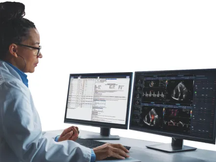 Radiologist viewing patient images on 2 computer screens