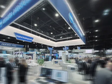 A photo of the RSNA 2025 booth with people movement in it