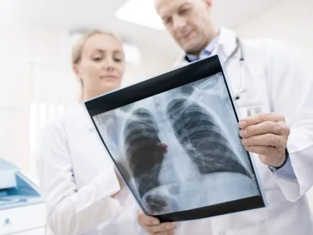 2 Doctors looking over a printed X-ray