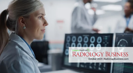 An image of a female radiologist reviewing images on a computer screen