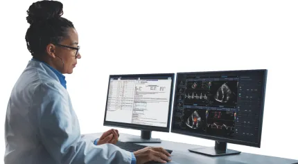 Radiologist viewing patient images on 2 computer screens