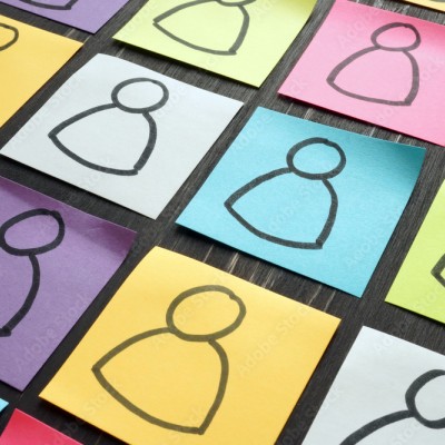 showing diversity with people drawn on colored post-it notes