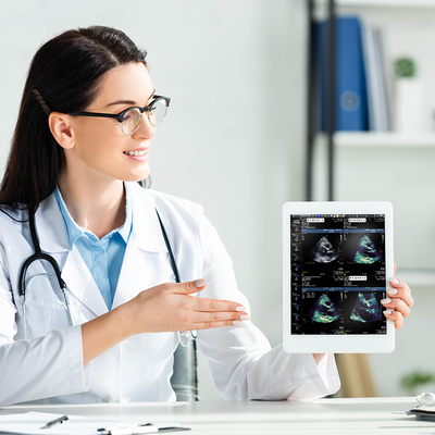 Doctor showing an Exa Cardio image on a tablet