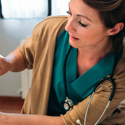 Doctor using Exa Ortho viewer on a tablet with a patient