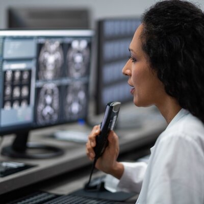 Healthcare Female Worker In-Hospital With Computer And-MRI