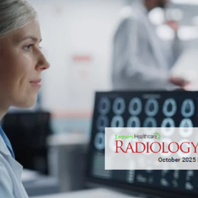An image of a female radiologist reviewing images on a computer screen