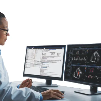 Radiologist viewing patient images on 2 computer screens